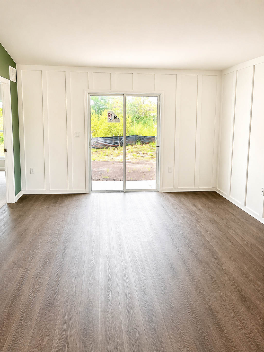 Completed living room with new flooring and trim