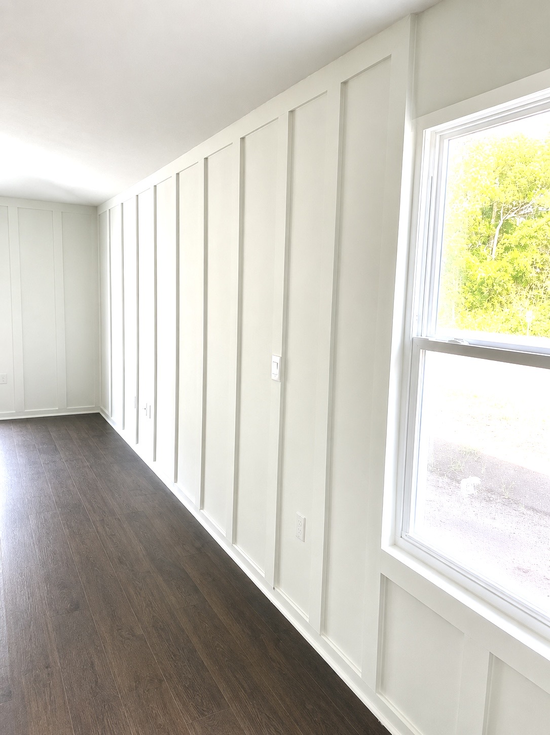 Custom board and batten trim work with hardwood floor